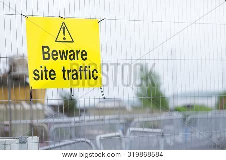 Beware Construction Site Traffic Sign On Fence
