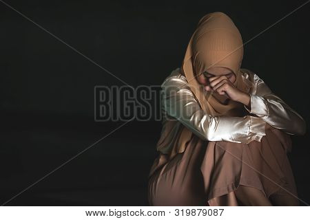 Young Muslim Women Sitting And Feeling Pain.. Lonely Muslim Girl Harly Thinking How To Solve Life Pr
