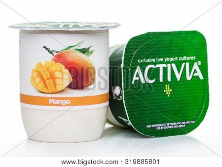 London, Uk - August 18, 2019: Cup Of Activia Exclusive Live Yogurt Cultures With Mango On White Back
