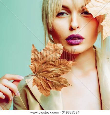 Autumn Woman. Hello September. Model Face Close-up. Autumnal Foliage. Autumn Clothing. Autumn Leaves