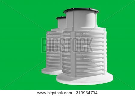 White Plastic Caisson For Water From A Well. Isolated Green Background. Large White Barrel With A Li