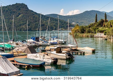Pier With Boats On Lake Lugano In Morcote, Switzerland