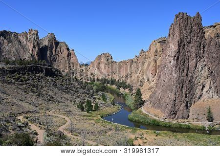 Smith Rock State Park And Crooked River Near Town Of Terrebonne, Oregon On Cloudless Summer Day.