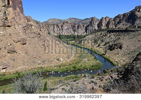 Smith Rock State Park And Crooked River Near Town Of Terrebonne, Oregon On Cloudless Summer Day.
