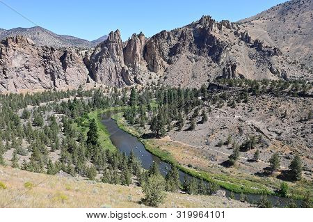 Smith Rock State Park And Crooked River Near Town Of Terrebonne, Oregon On Cloudless Summer Day.