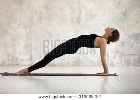 Beautiful Woman Practicing Yoga, Purvottanasana, Upward Plank Exercise