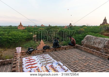 Bagan, Myanmar - 06 December, 2018: Horizontal Picture Of Burmese People Selling Paintings On The Ro