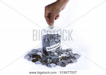 Saving Idr Coins In The Glass Bottle Jar For Vacation On White Background Wirh Copyspace