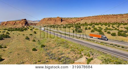 Vehilces Travel Along Close To The Laguna Pueblo Along Highway 40 In The Desert Southwest