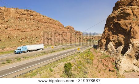 Vehilces Travel Along Close To The Laguna Pueblo Along Highway 40 In The Desert Southwest