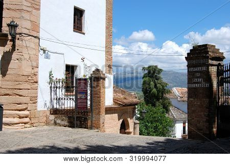 Ronda, Spain - May 13, 2008 - Gateway Between The Town Hall (left) And Marys Helpers Sanctuary With 