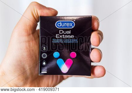 Tyumen, Russia-april 22, 2021: Hand Holds A Box Of Durex Brand Condoms. Dual Extase