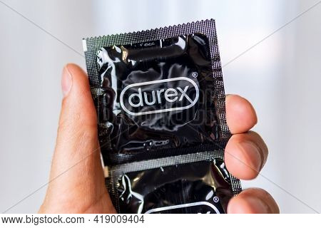Tyumen, Russia-april 22, 2021: Hand Holds A Box Of Durex Brand Condoms.