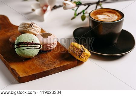 Aromatic Morning Coffee And Macarons On White Background, Flat Lay