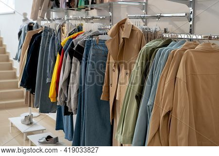 Stylish Collection Of Womens Clothing Hanging On Hangers In The Showroom. Copspace