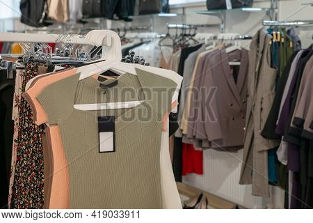 Stylish Collection Of Womens Clothing Hanging On Hangers In The Showroom. Copspace