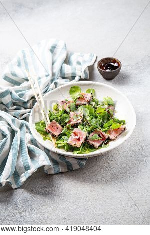 Japanese Sliced Grilled Tuna Steak Salad With Sesame And Suace. Close Up