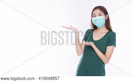 Positive Young Woman Wearing Safety Medical Mask Protection From Inhaling Airborne Bacteria Or Virus