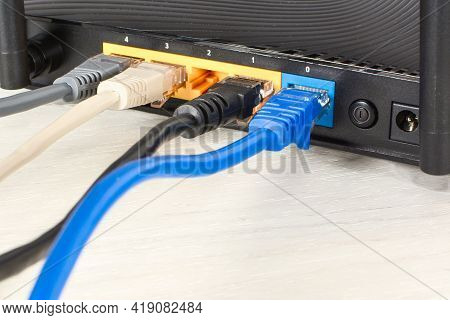 Home Wi-fi Router For Internet Connection With Four Patch Cords With Rj45. Concept Home Network, Clo