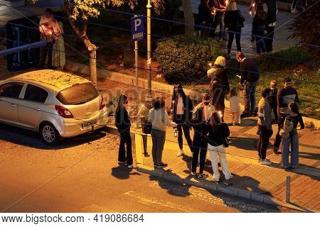 Thessaloniki, Greece - May 01 2021: Orthodox Easter 2021 Anastasi Resurrection. Faithful Wearing Fac