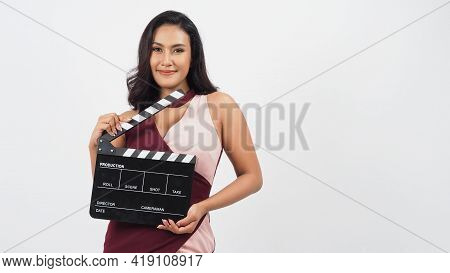 Asian Woman Is Holding Clapper Board Or Movie Slate Use In Video Production ,film, Cinema ,movies In