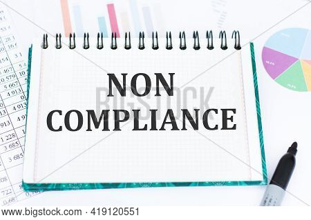 Non Compliance Text On White Notepad Paper On Office Desk