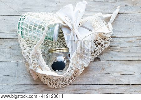 Reusable Cotton Bag And Glass Jars On Wooden Background. Zero Waste Shopping. Sustainable Living, Pl