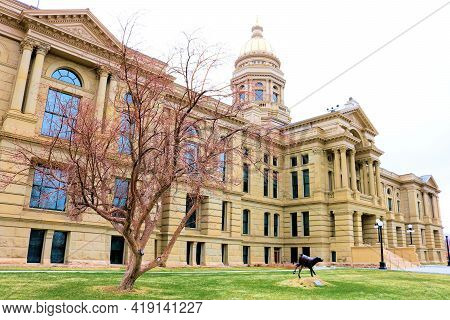 April 26, 2021 In Cheyenne, Wy:  Historical State Capital Building Surrounded By Grass And Trees Tak