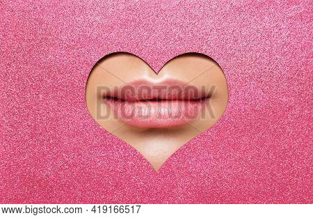 Beauty Lips Makeup Close Up. Natural Plump Bright Lip Glossy Lipstick Look Through Heart Shaped Hole