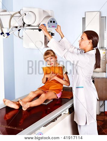 Little girl with doctor radiologist.