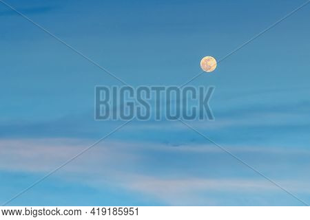 Large Pale Full Mon Over Blue Pink Clouds In The Evening Sky. Amazing Tranquil Twilight Skyscape. Аs