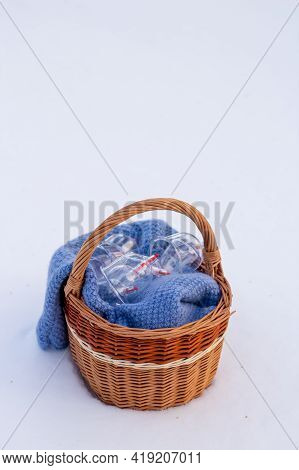 Jars For Hijama In A Basket In The Snow. Wicker Basket. Bloodletting According To The Sunnah. Vacuum