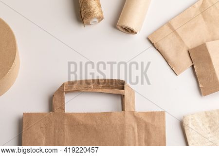 Eco-friendly Packaging Materials. Paper Bag, Cloth Bag, Jute Rope, Cardboard Round Gift Box On A Whi