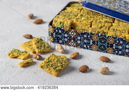 Traditional Persian Dessert Sohan From Iran In Box On Gray Background. Close-up