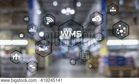Inscription Wms On Blurred Warehouse Background. Werehouse Management System