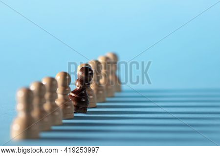 Chess Pieces In A Row, White Pawns On A Blue Background,