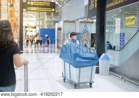 Bangkok Thailand Apr 14 2021 The Worker  Wearing Surfical Mask And Hand Pushing The Trolley Of Equip
