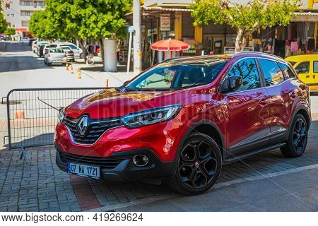 Alanya, Turkey - April 17 2021:  Red Renault Kadjar    Is Parked  On The Street On A Warm Summer Day