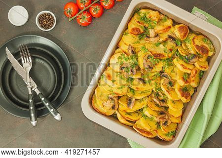 Potato Wedges Baked With Mushrooms, Herb Oven Roasted, With Thyme, A Close-up In A Baking Tray. Top 