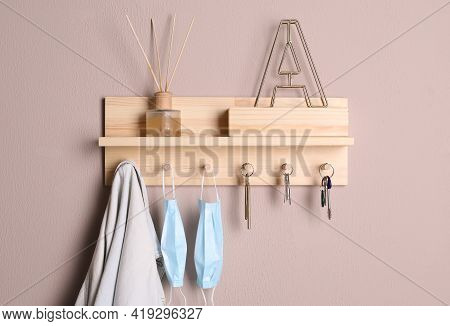 Wooden Hanger For Keys On Color Wall