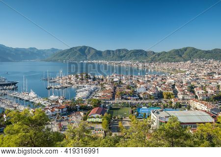 Cityscape of resort town Marmaris in Mugla province, Turkey. Marmaris is a port city and popular tourist resort on the Mediterranean coast in Mugla Province, Turkey.