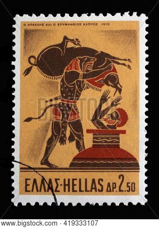 ZAGREB, CROATIA - SEPTEMBER 18, 2014: Stamp printed in Greece shows Hercules Deeds - Hercules and the Erymanthian Boar, circa 1970