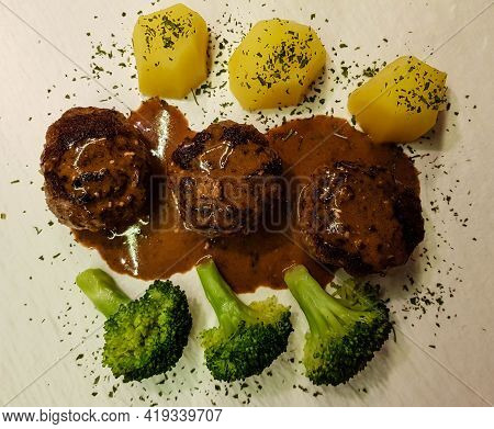 Fried Meatballs With Boiled Broccoli And Parsley Potatoes