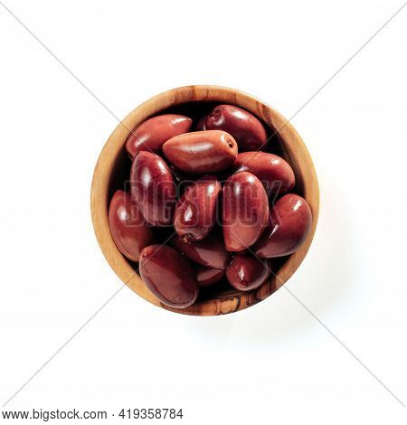 Small Wooden Bowl With Red Kalmata Olives Isolated On White Background. Flat Lay Or Top View Of Smal