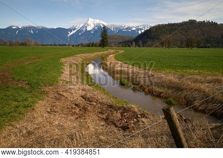 Mount Cheam Agassiz British Columbia. A Farm Field In The Fraser Valley With Mount Cheam In The Back