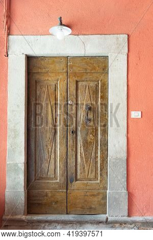 Beautiful Front Door. A Very Old Door To One Of The Thousand-year-old Houses In Barga.