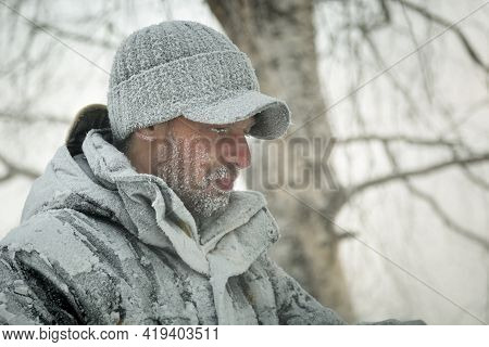 Portrait Of A Worker In A Black Cap