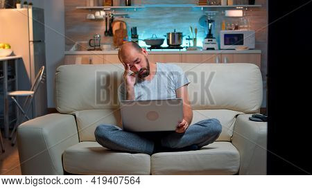 Tired Man In Pajams Browsing On Internet Lifestyle Information