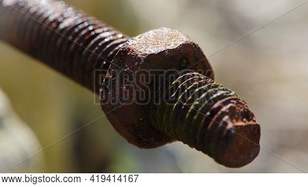 Rusty Nut. Rusty Iron Rod With Screw Threads. Rusted Mechanical Components. Threaded Bolt And Nut Is