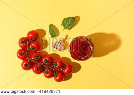 Homemade Diy Natural Tomatoes With Bazil And Pepper On Yellow Background